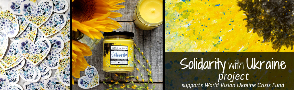 Solidarity with Ukraine project - the image shows blue and yellow floral heart-shaped stickers, a Solidarity scented candle with sunflowers, and a painted sunflower watercolor background.